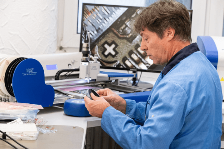 Man soldering at a work bench